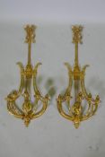 A pair of ormolu empire style five branch wall sconces of lyre form, 97cm high