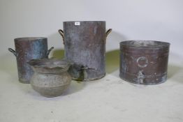 An antique copper cistern, 36cm diameter, 46cm high, another smaller, and a copper planter