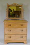 A Victorian stripped pine dressing table with swing mirror and three drawers, 81 x 46 x 17cm