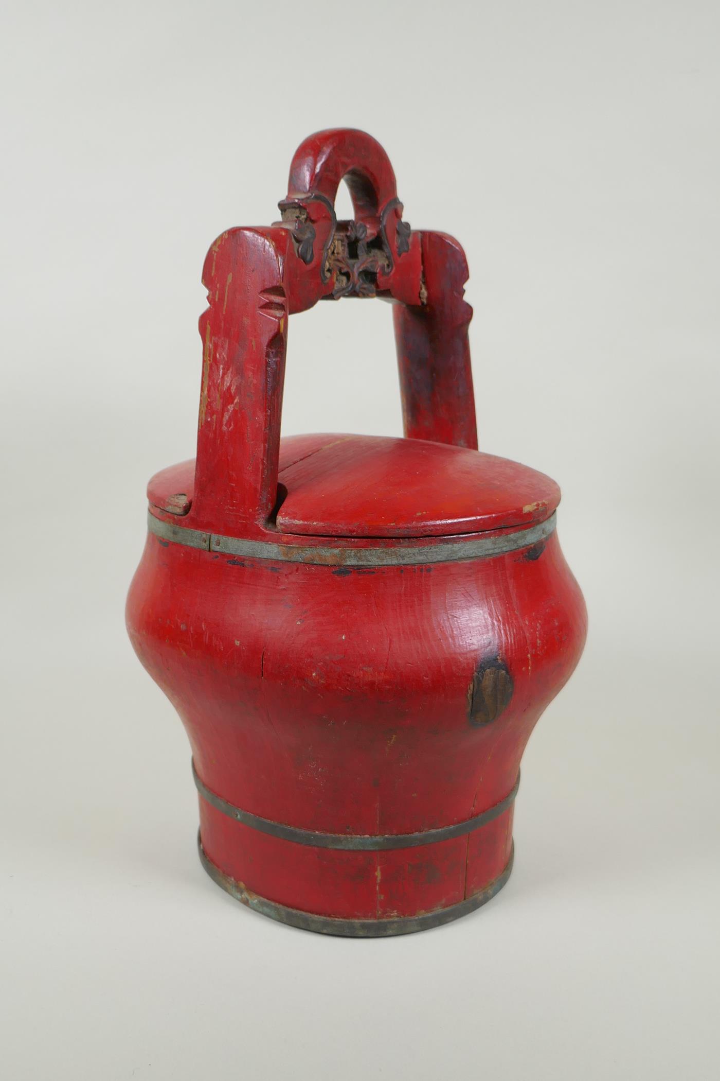 A Chinese red lacquered wood food carrier, 36cm high - Image 2 of 4