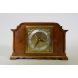 A walnut cased Elliott mantel clock, inscribed G.W. Benson, London, with silvered chapter ring and