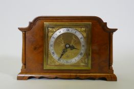 A walnut cased Elliott mantel clock, inscribed G.W. Benson, London, with silvered chapter ring and