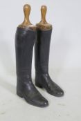 A pair of vintage black leather riding boots, with beech trees, 26cm long