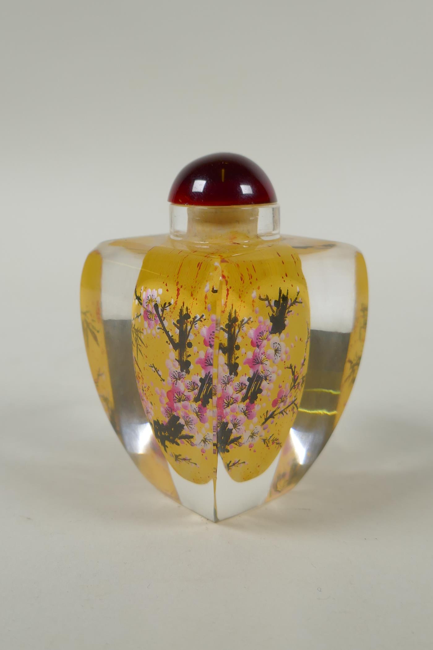 A Chinese reverse painted glass snuff bottle decorated with a branch in bloom, 9cm high - Image 2 of 7