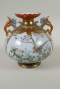 A Japanese late Meiji period Kutani porcelain two handled vase with enamelled decorative panels