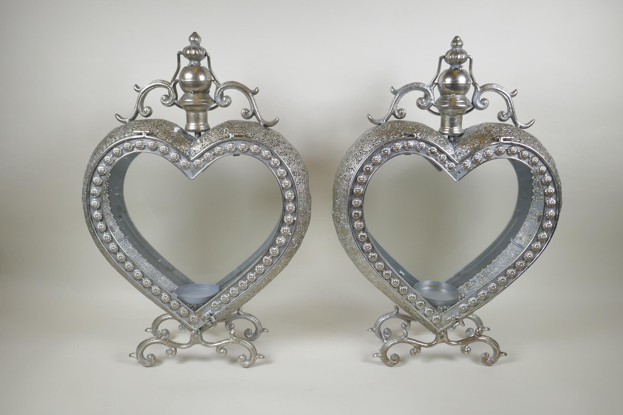 A pair of silvered metal heart shaped lanterns, 51cm high