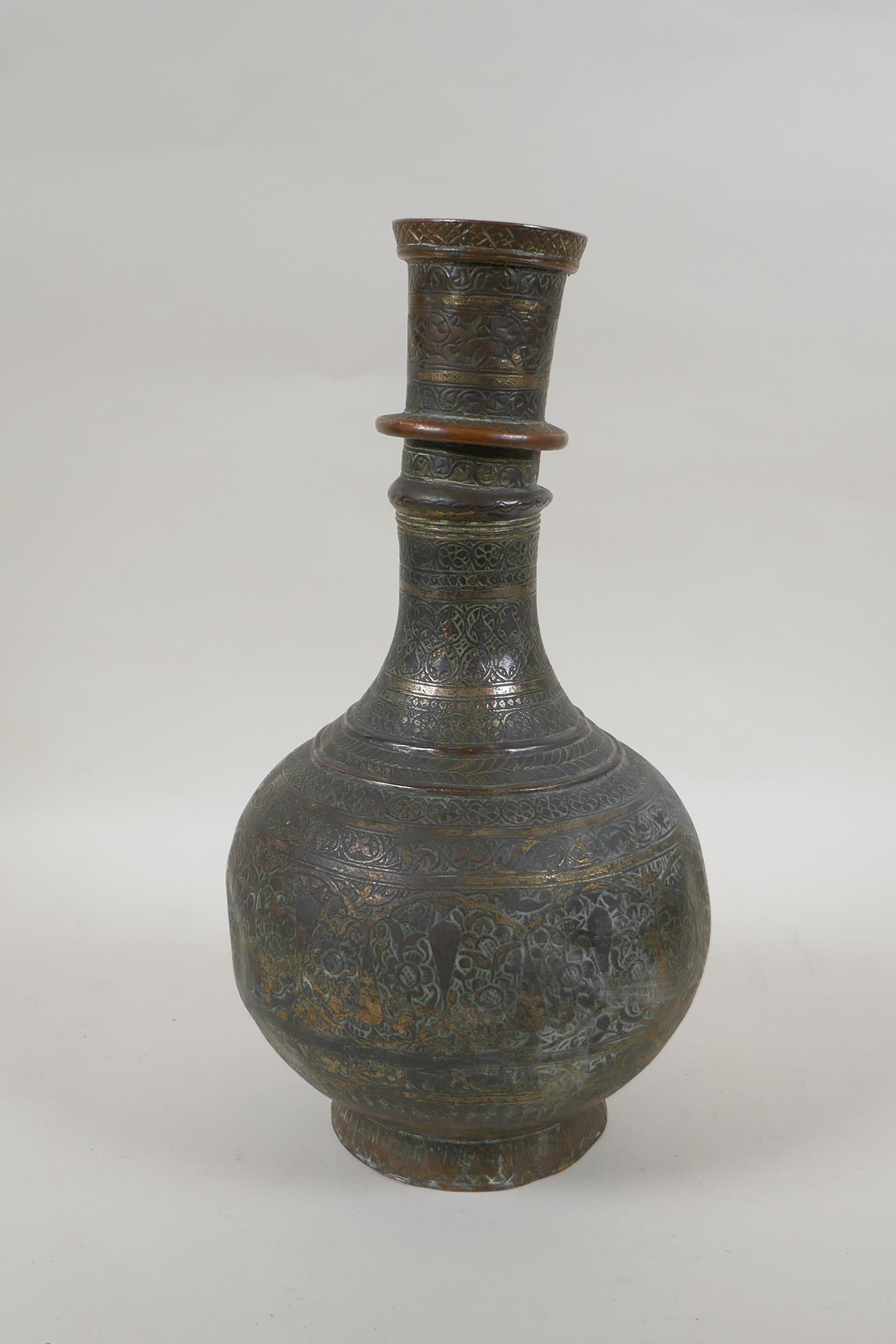 An antique Islamic patinated copper hookah base, 32cm high