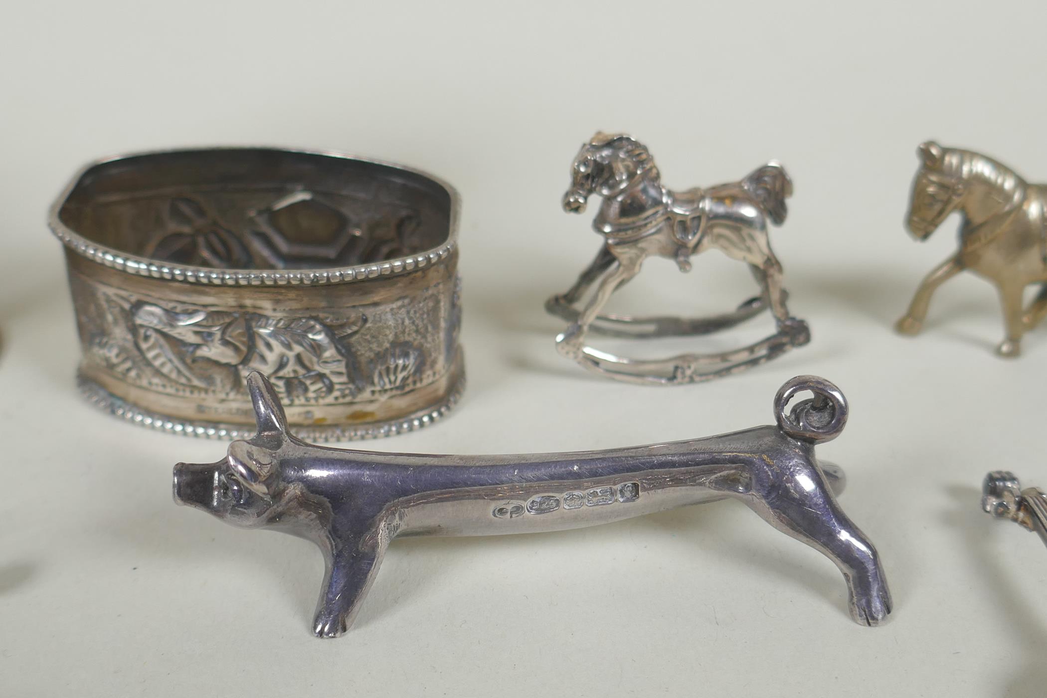 A quantity of silver items to include belt buckles, napkin rings, cups, knife rests, etd, 230g, - Image 7 of 8