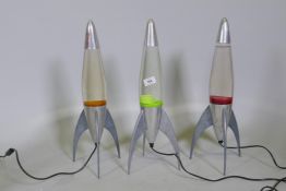 Three Mathmos Telstar lava lamps, 50cm high, one top dented