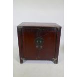 An antique Chinese red lacquered side cabinet with two doors, 78 x 50cm, 78cm high