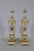 A pair of Empire style painted wood urn shaped table lamps with gilt decoration, 63cm high