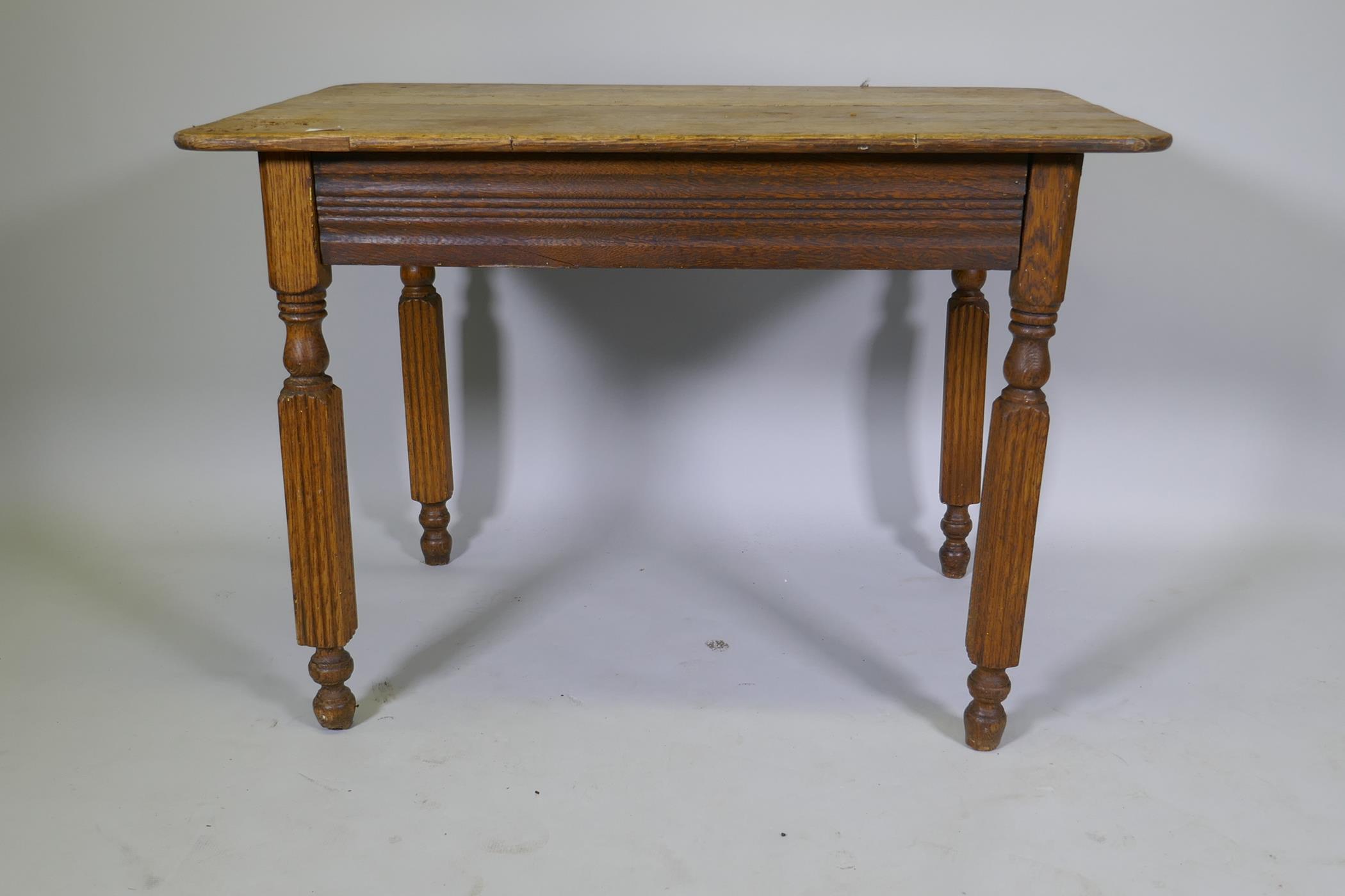 An antique continental oak plank top table, raised on reeded supports, 103 x 74 x 74cm - Image 3 of 3