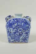 A Chinese blue and white porcelain flask with four loop handles in the form of dragons, and