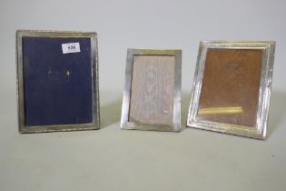 Three hallmarked silver photo frames, largest aperture 14.5 x 19.5cm