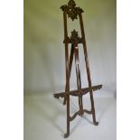 A carved mahogany adjustable easel, 220cm high
