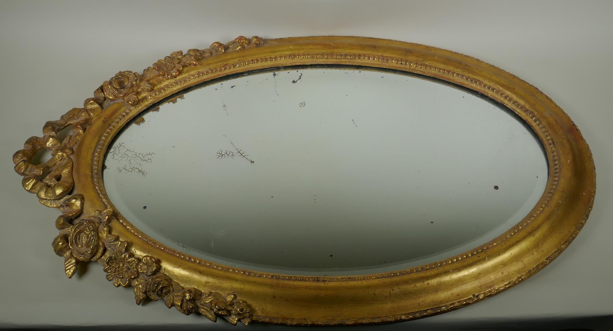 An antique French oval gilt mirror, with bevelled antique glass, 53 x 87cm - Image 2 of 8