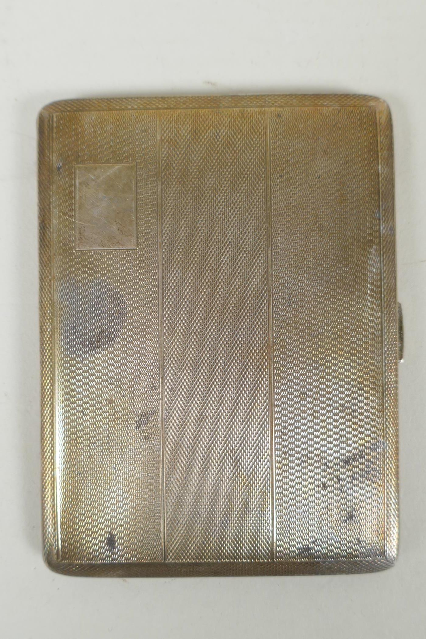 A hallmarked engine turned silver cigarette case by Joseph Gloster Ltd, Birmingham, 1963, 8.5 x 11.