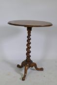 A Victorian inlaid walnut occasional table, raised on a barleytwist column and tripod supports, 62 x