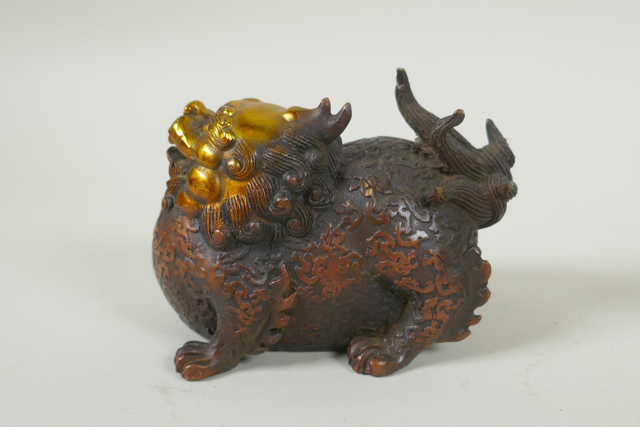 A pair of Chinese filled bronze kylin with gilt heads, 11cm long - Image 3 of 5