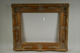 A C20th gilt picture frame with scroll and floret decoration, rebate 51 x 41cm