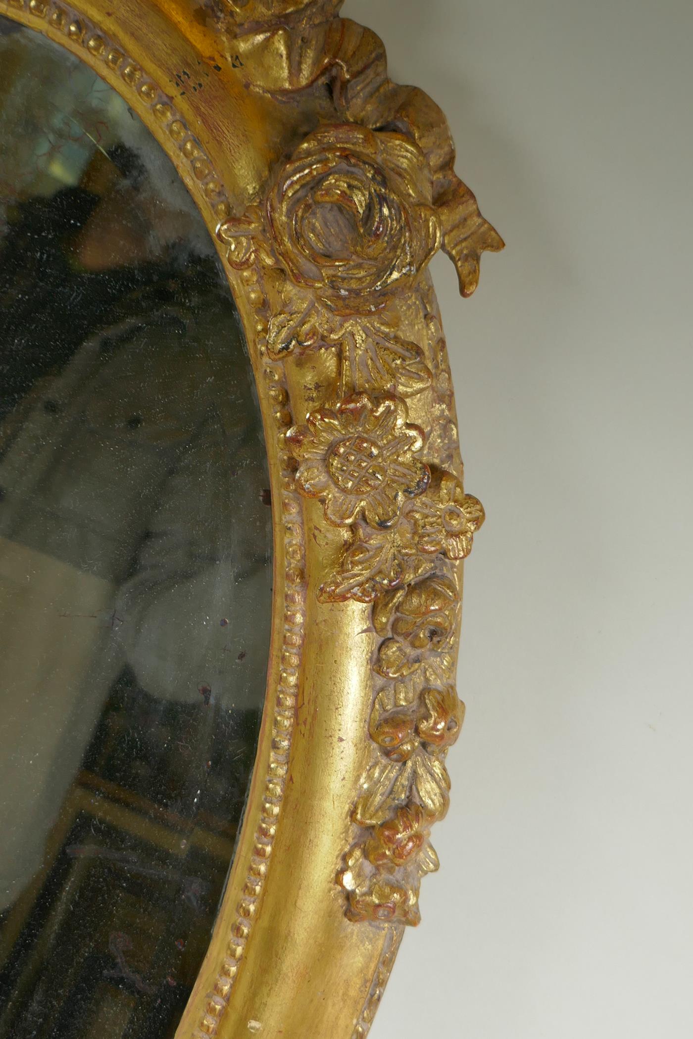 An antique French oval gilt mirror, with bevelled antique glass, 53 x 87cm - Image 5 of 8