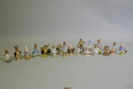 A collection of vintage Beswick Beatrix Potter figurines, gold and brown back stamps including