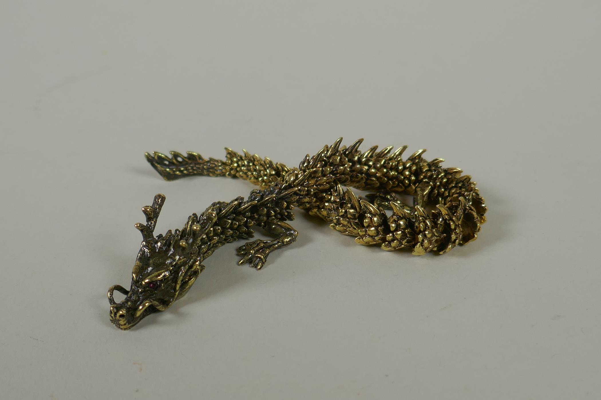 A Japanese Jizai style bronze okimono dragon, with articulated body and legs, 23cm long - Image 5 of 5