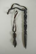 A Tibetan steel phurba with skull mask decorated to the handle and a miniature bronze vajra, 14cm