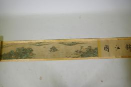 A Chinese printed watercolour scroll depicting an extensive riverside landscape, 29cm high