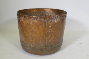 An antique copper jardiniere/planter of rivetted construction, 48cm diameter x 40cm high