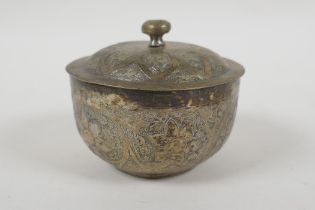 An Islamic white metal bowl, with all over script decoration, 8cm diameter, 98g