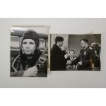 Two vintage press photos of Yuri Gagarin, with archival stamps and typed Cyrillic descriptions