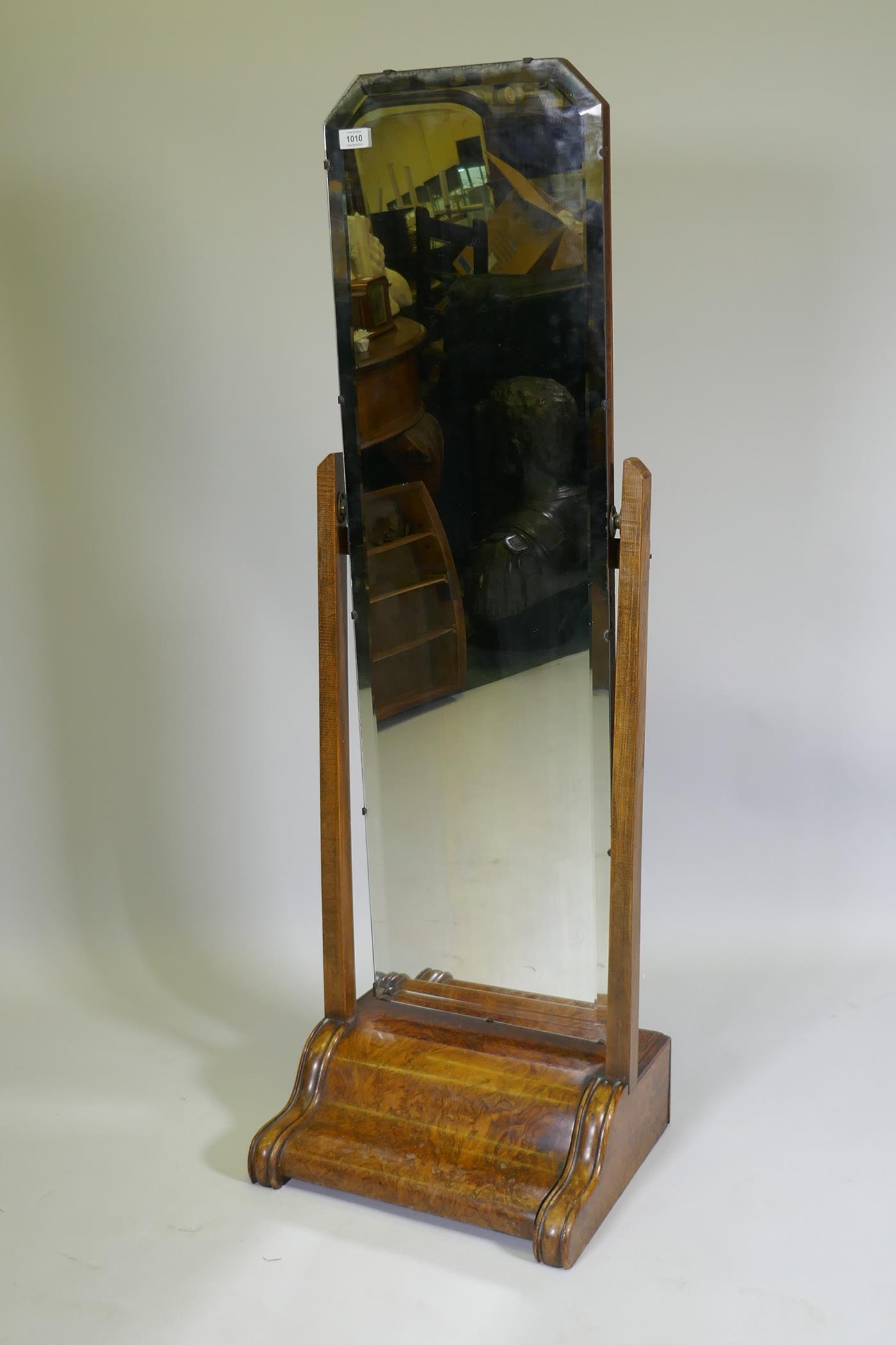 A 1930s figured walnut cheval mirror, 140cm high