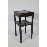 An antique Chinese hardwood two tier side table with single drawer, 39 x 39cm, 75cm high