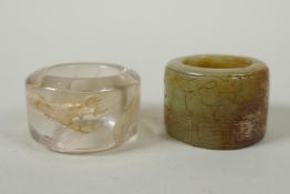 A Chinese crystal archers thumb ring, with engraved dragon decoration, and a nephrite jade thumb