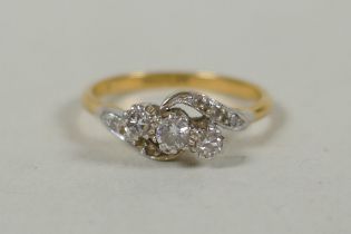 A vintage 18ct gold and platinum diamond trilogy twist ring, approx 0.3ct, size M, 2.5g gross