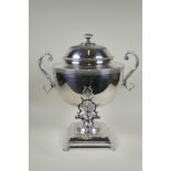 A fine Victorian silver plated samovar/tea urn, with two handles and paw feet, the cover interior