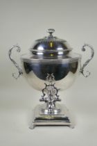 A fine Victorian silver plated samovar/tea urn, with two handles and paw feet, the cover interior