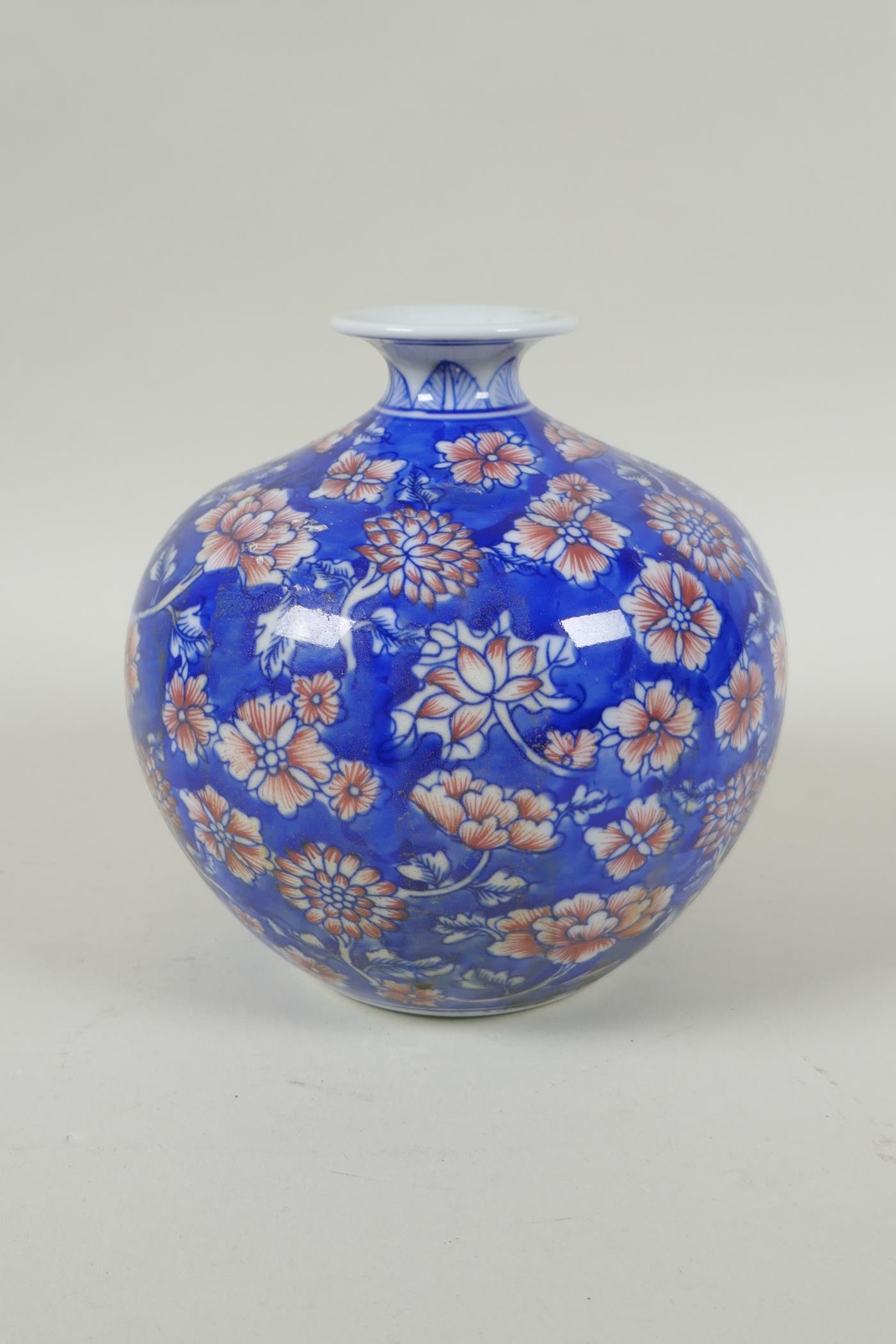 A Chinese blue and white porcelain pomegranate shaped vase, with allover floral decoration and red - Image 3 of 5