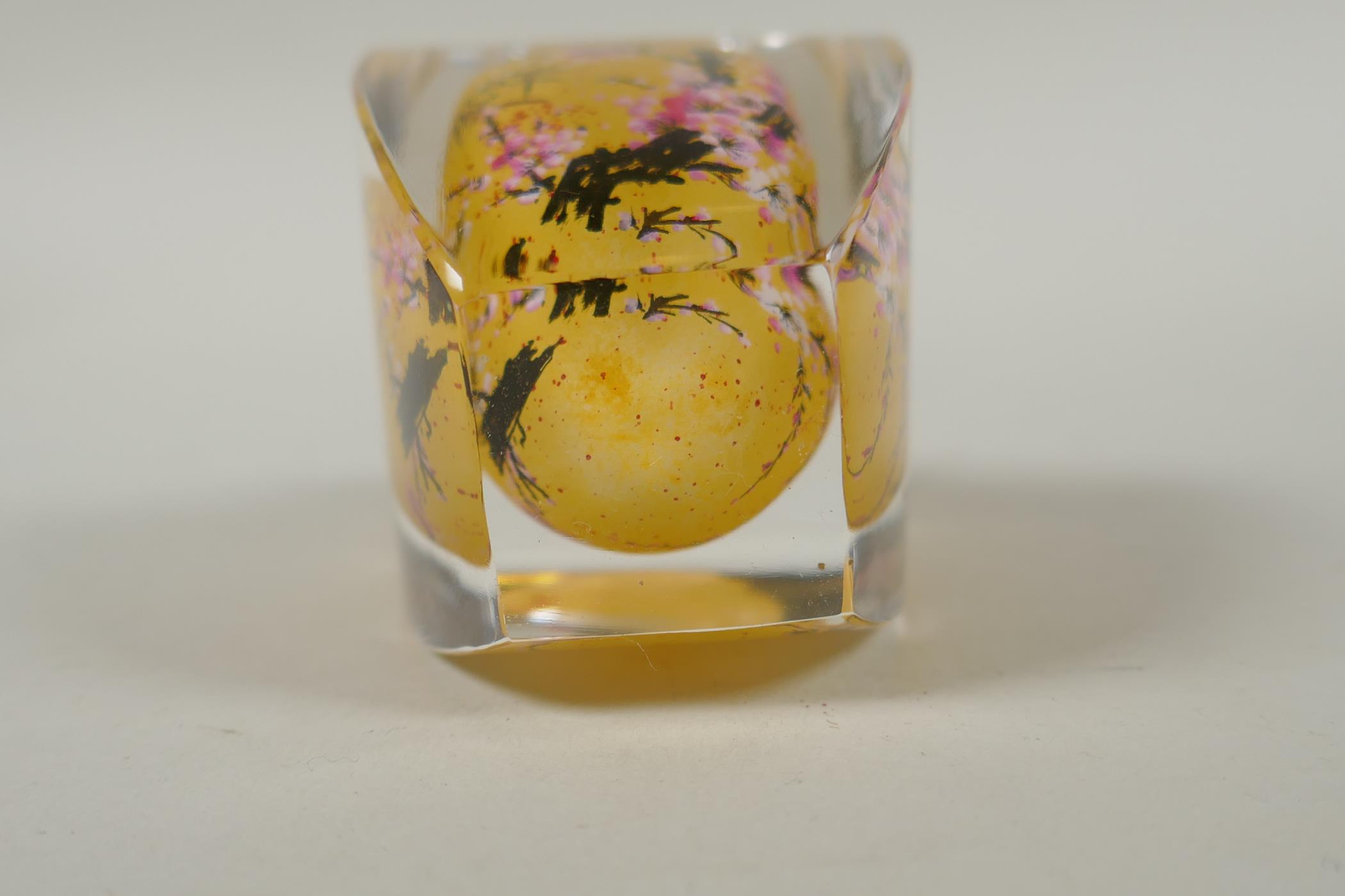 A Chinese reverse painted glass snuff bottle decorated with a branch in bloom, 9cm high - Image 7 of 7