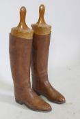 A pair of vintage brown leather riding boots, with beechwood trees, 28cm long