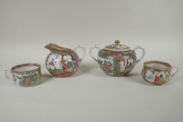 A Chinese Republic Canton famille rose porcelain sugar pot, jug and two tea cups, largest 12cm