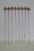 A set of eight cast iron gothic style plant stakes, 106cm long