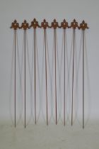 A set of eight cast iron gothic style plant stakes, 106cm long