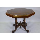 A Victorian inlaid walnut octagonal tilt top occasional table, raised on four turned columns and