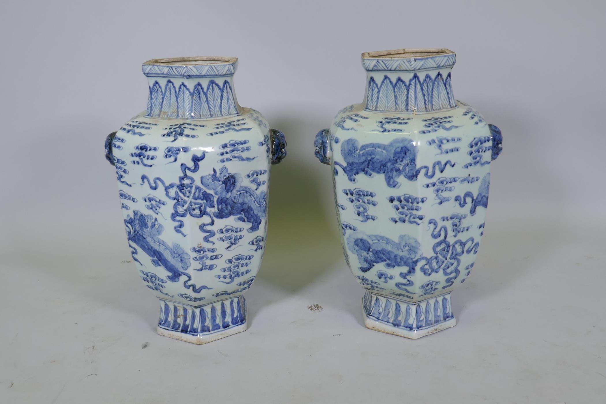 A pair of Chinese blue and white per hexagonal vases with two lion mask handles and kylin