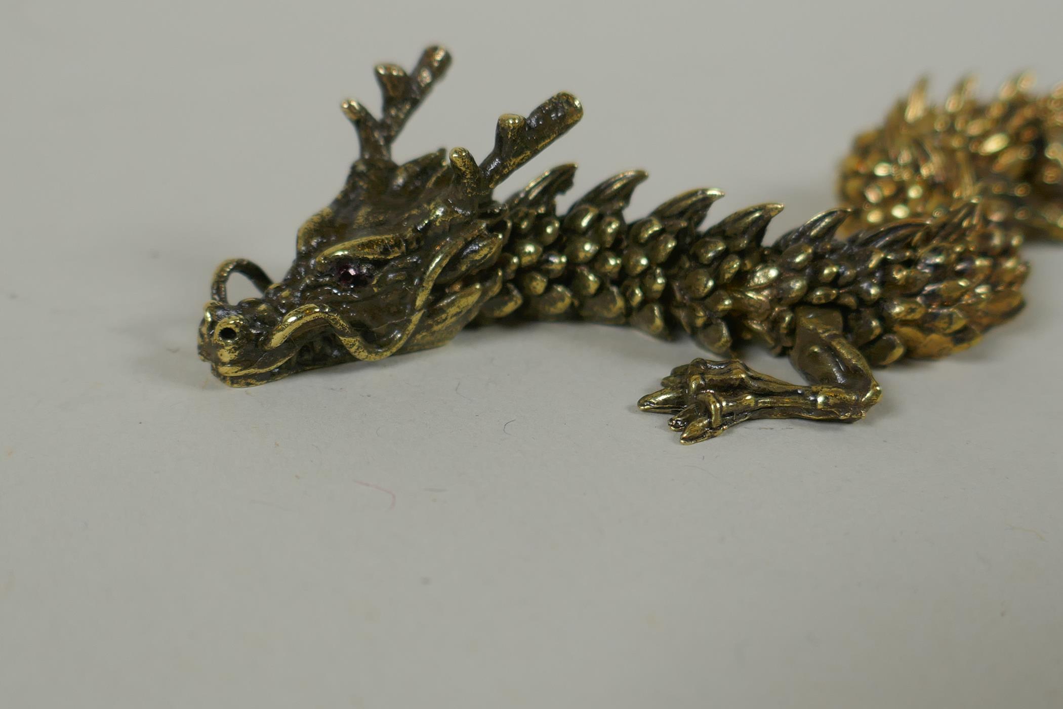 A Japanese Jizai style bronze okimono dragon, with articulated body and legs, 23cm long - Image 2 of 5