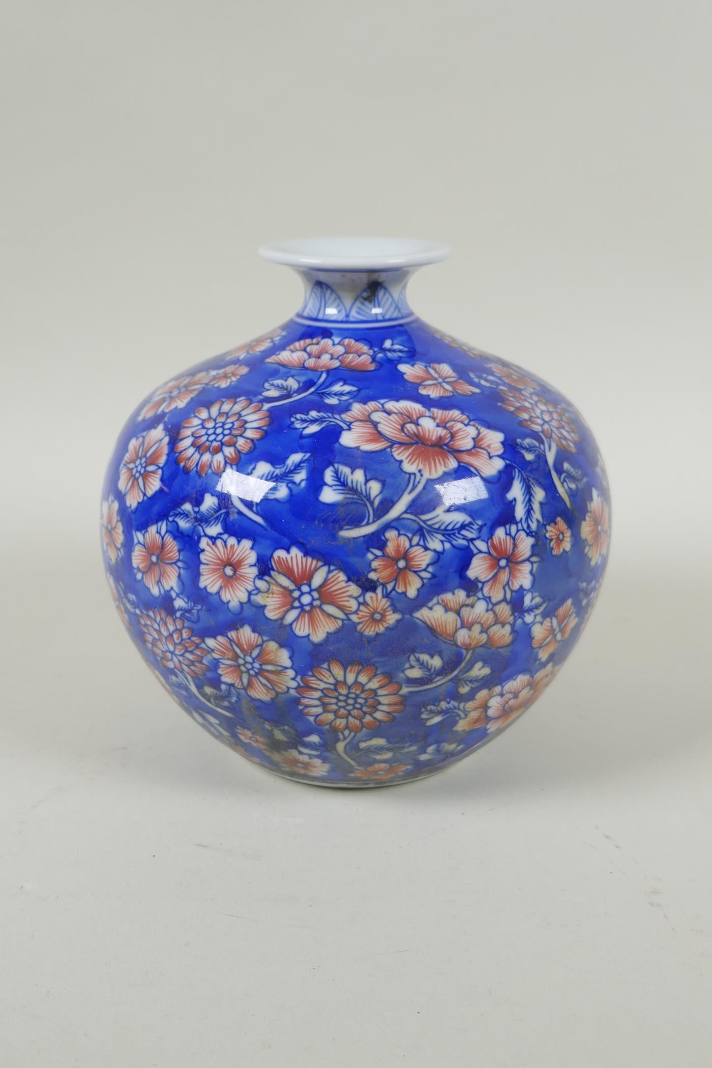 A Chinese blue and white porcelain pomegranate shaped vase, with allover floral decoration and red - Image 4 of 5