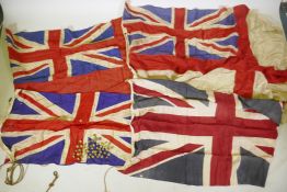 Four vintage British Naval flags to include two Union Jacks, a white St George's cross ensign and