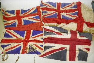 Four vintage British Naval flags to include two Union Jacks, a white St George's cross ensign and